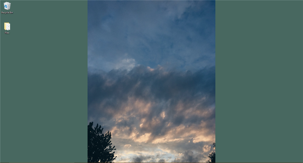 Background photos do no fit the screen. None of the "choose a fit" options work. 83793564-82e2-4f25-bb8b-f178b0ffc087.png