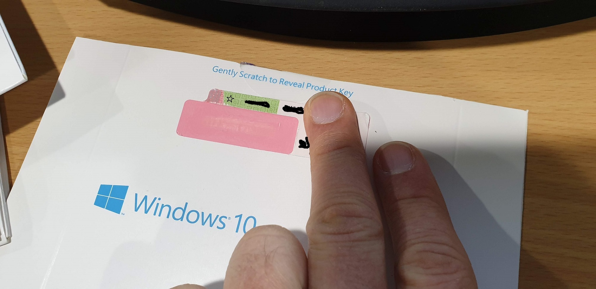 'Gently scratch to reveal product key' isn't scratchable on Windows 10 licence pink tape -... d9db99ad-93ca-4e07-bc9f-783aadc80cec?upload=true.jpg