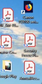 Windows 10 two small arrows lower left corner of desktop icons?
