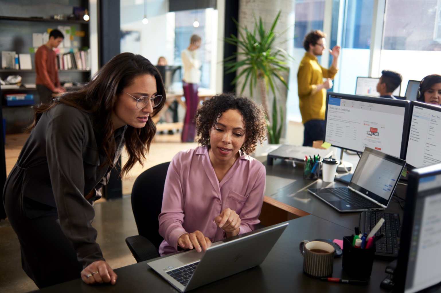 Microsoft increasing transparency and customer control over data Two-women-in-office-with-laptop.jpg